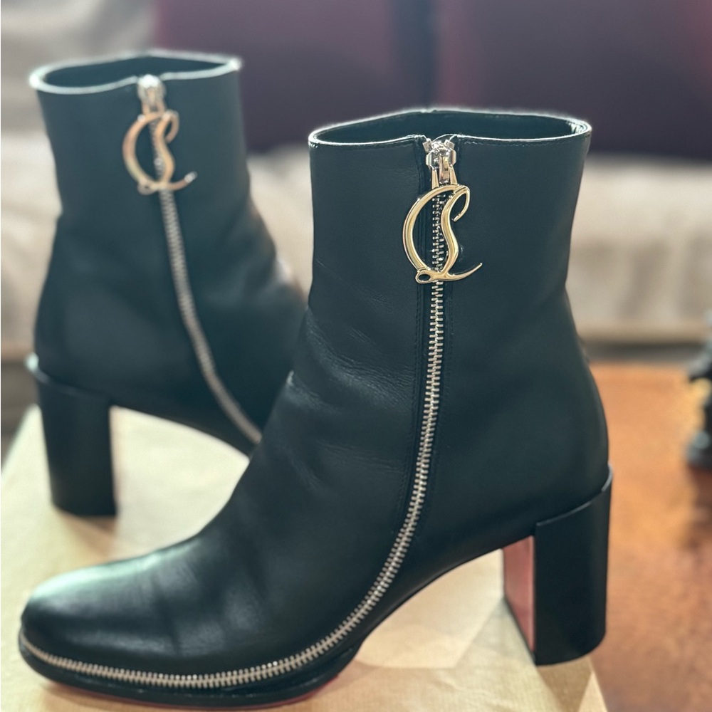 Elegant Black Ankle Boots with Silver Zipper by Christian Louboutin